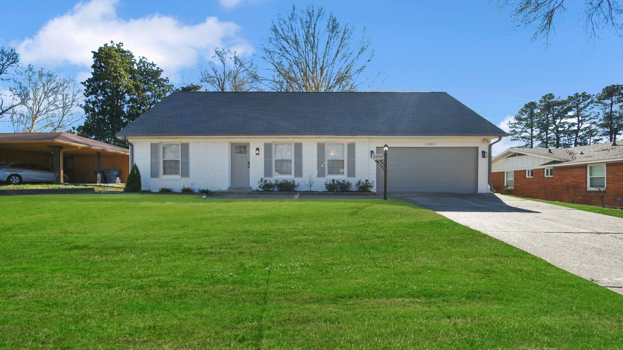 2800 Spring Hill Drive Memphis, TN 38127 - Photo 1 of 31 a front view of house with yard and green space