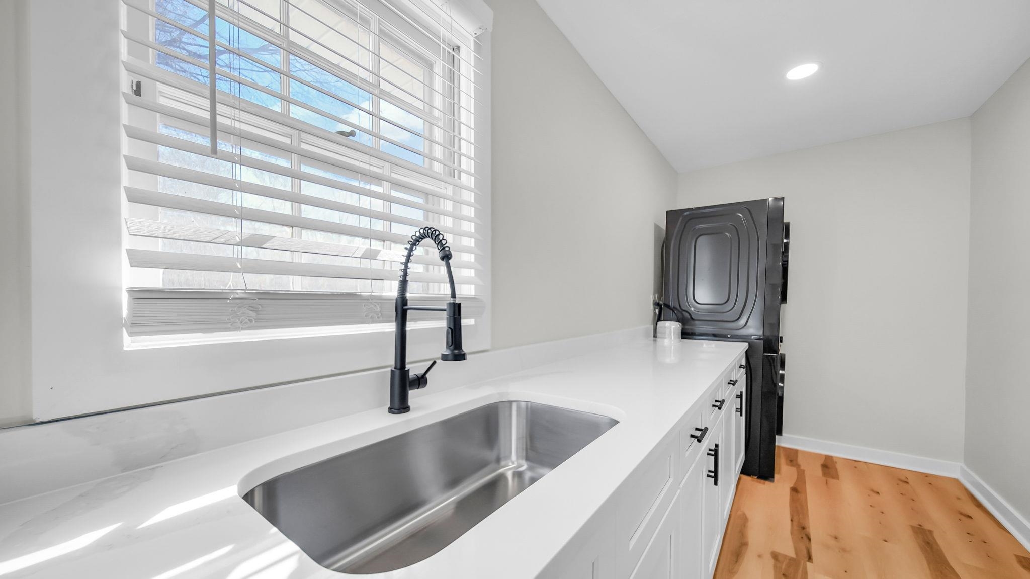 2800 Spring Hill Drive Memphis, TN 38127 - Photo 22 of 31 a kitchen with a sink cabinets and appliances