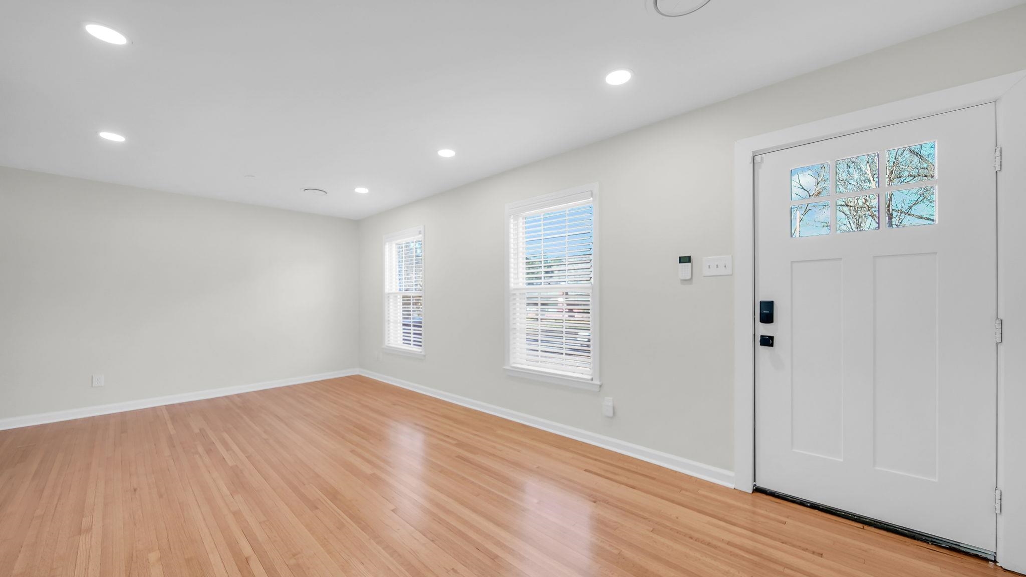 2800 Spring Hill Drive Memphis, TN 38127 - Photo 7 of 31 a view of an empty room with wooden floor and a window