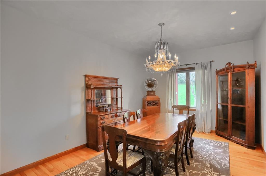 110 Larkspur Circle Butler, PA 16002 - Photo 11 of 50 Enjoy intimate meals, family gatherings and everything in between in this spacious dinging room with a stylish chandelier, hard wood flooring and a view of the rear yard.