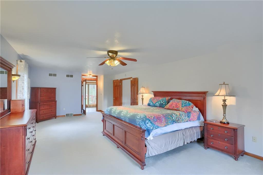 110 Larkspur Circle Butler, PA 16002 - Photo 26 of 50 The primary bedroom features space for larger furniture, has bright windows and a large spa like bathroom.