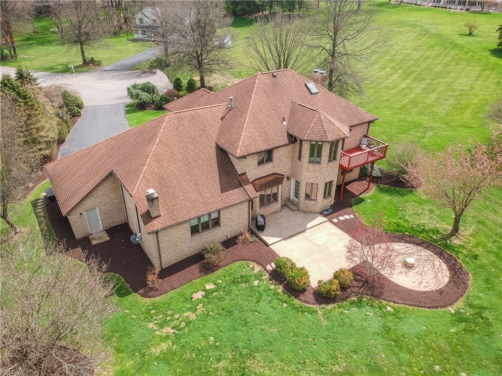 110 Larkspur Circle Butler, PA 16002 - Photo 3 of 50 The rear of the home features a man door from the garages, an oversized patio that leads to a round patio perfect fore a fire pit, and a quaint deck off the primary bedroom for peaceful morning coffee.
