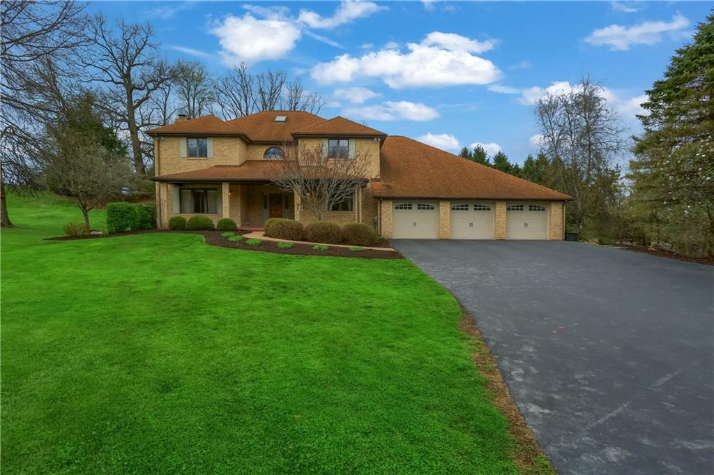 110 Larkspur Circle Butler, PA 16002 - Photo 4 of 50 Well manicured homesite features lush grass and immaculate mulch beds and landscaping.