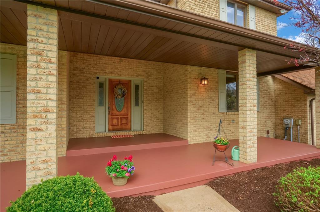 110 Larkspur Circle Butler, PA 16002 - Photo 5 of 50 Welcome guests to the expansive front porch with space for conversation sets and into the home through a beveled front door with sidelights.
