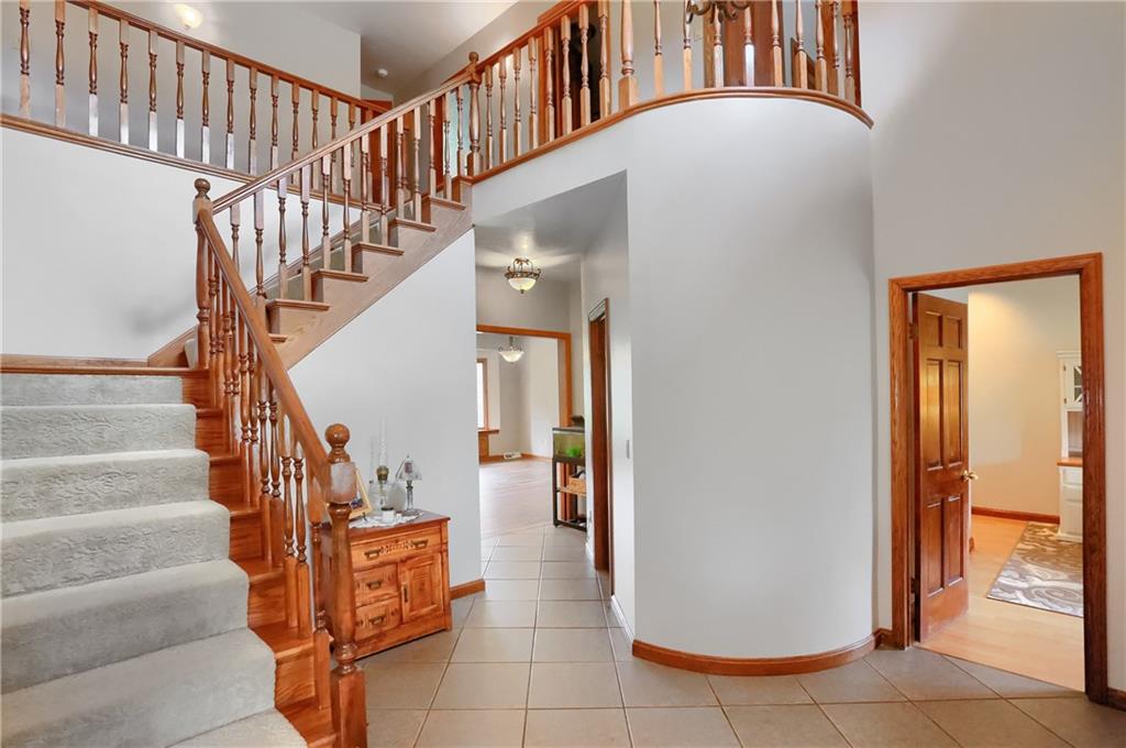 110 Larkspur Circle Butler, PA 16002 - Photo 7 of 50 The dramatic foyer showcases the beautiful staircase that leads to a second floor look over.