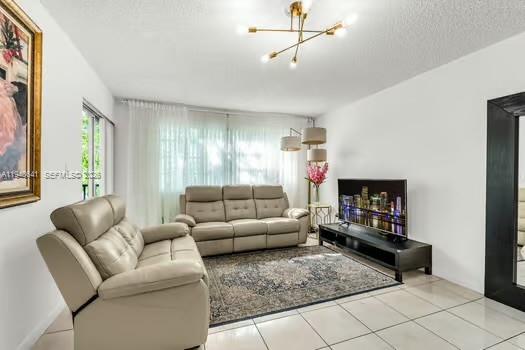 15430 Southwest 82nd Lane, Unit 625 Miami, FL 33193 - Photo 15 of 36 a living room with furniture and a couch