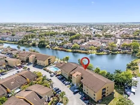 an aerial view of a city with ocean view