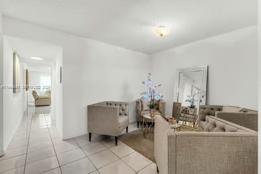 15430 Southwest 82nd Lane, Unit 625 Miami, FL 33193 - Photo 7 of 36 a living room with furniture and a mirror