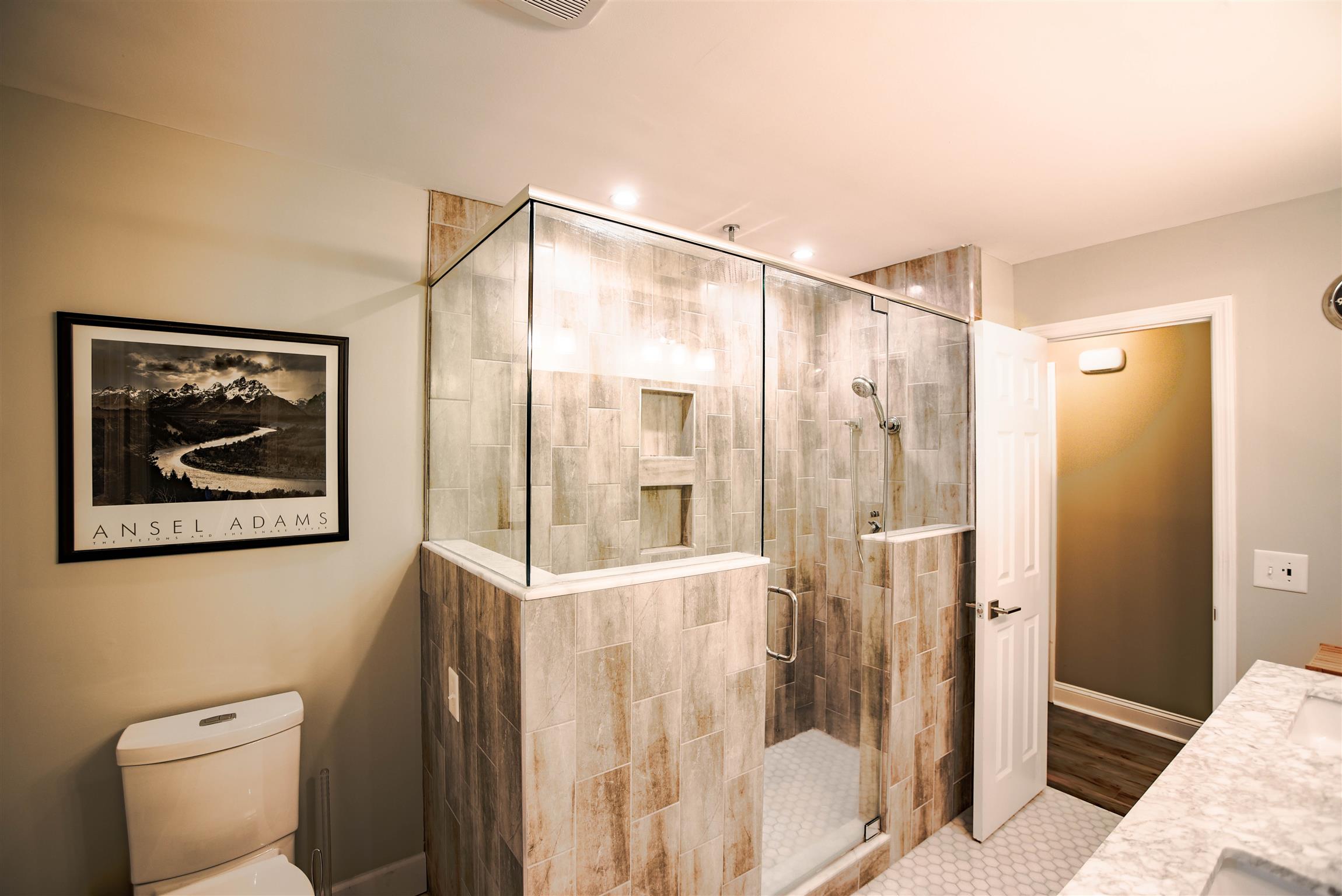 489 Northwest Rutland Road Mount Juliet, TN 37122 - Photo 11 of 22 The bathroom was also completely renovated and the owners installed a rainfall shower.