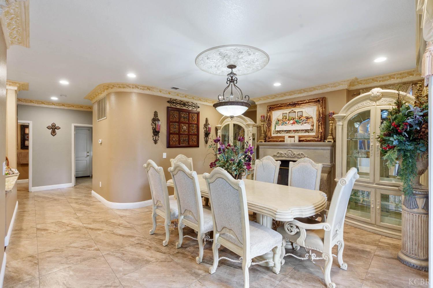 960 Vista Place Lemoore, CA 93245 - Photo 14 of 34 a view of a dining room with furniture and chandelier