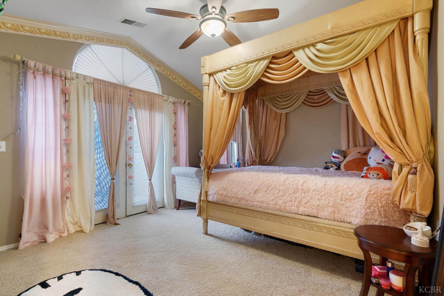 960 Vista Place Lemoore, CA 93245 - Photo 21 of 34 a bedroom with a bed and a closet