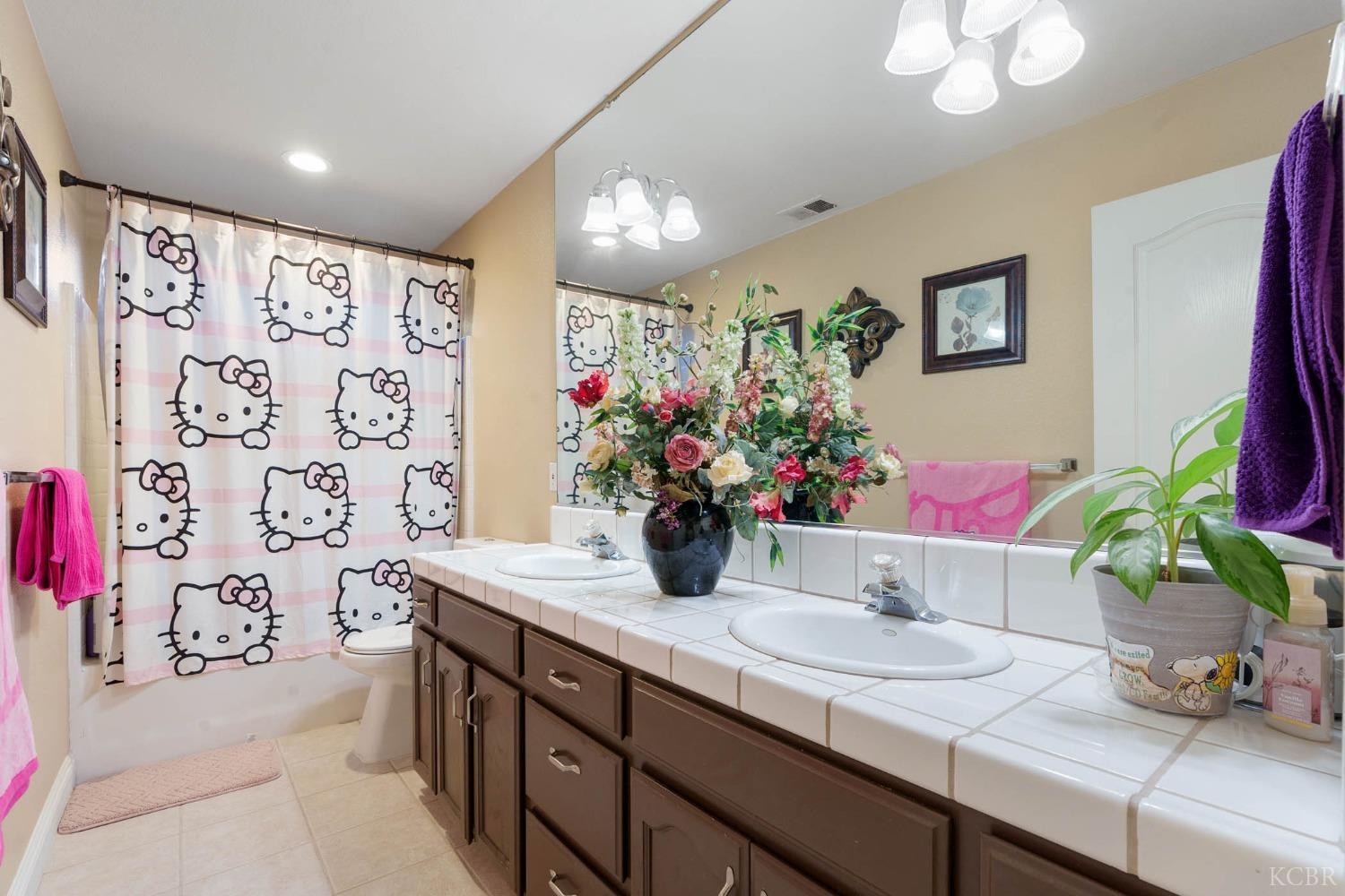 960 Vista Place Lemoore, CA 93245 - Photo 23 of 34 a kitchen with a sink and a table