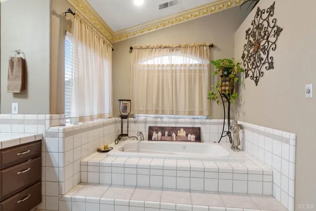 a bathroom with a toilet and a window