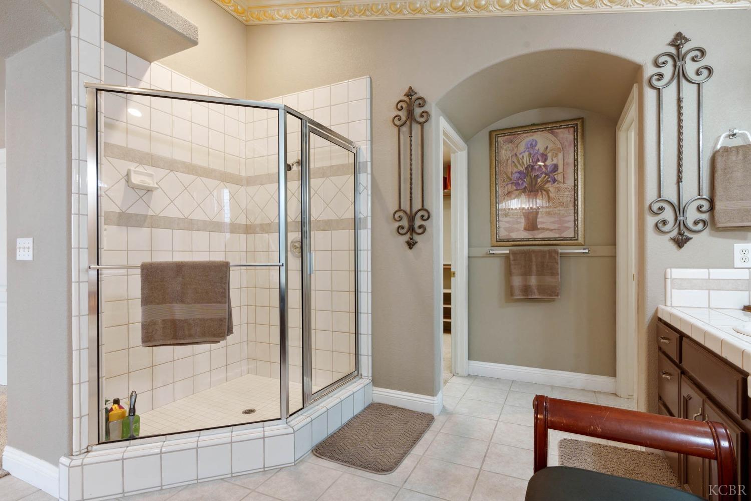 960 Vista Place Lemoore, CA 93245 - Photo 28 of 34 a bathroom with a shower