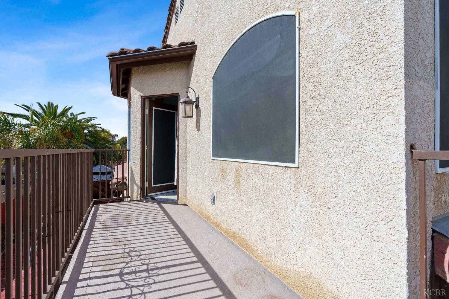 960 Vista Place Lemoore, CA 93245 - Photo 30 of 34 a view of a house with a wooden fence