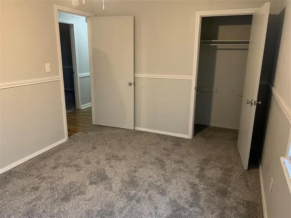 a kitchen with a stove and a refrigerator