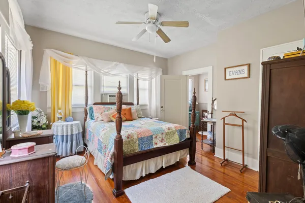 a bed room with a bed and a chandelier