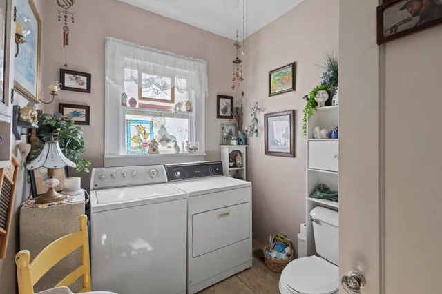 a kitchen with a sink and a stove next to a window