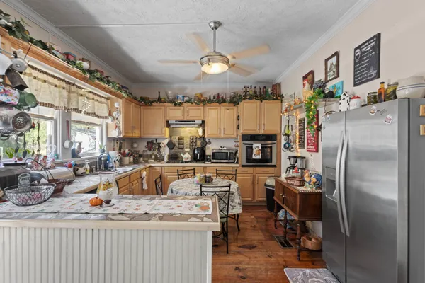 a view of a kitchen and dining room