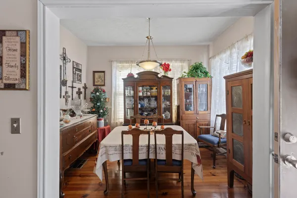 a dining room with furniture and window