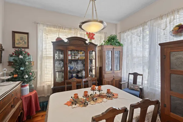 a view of a dining room with furniture and window