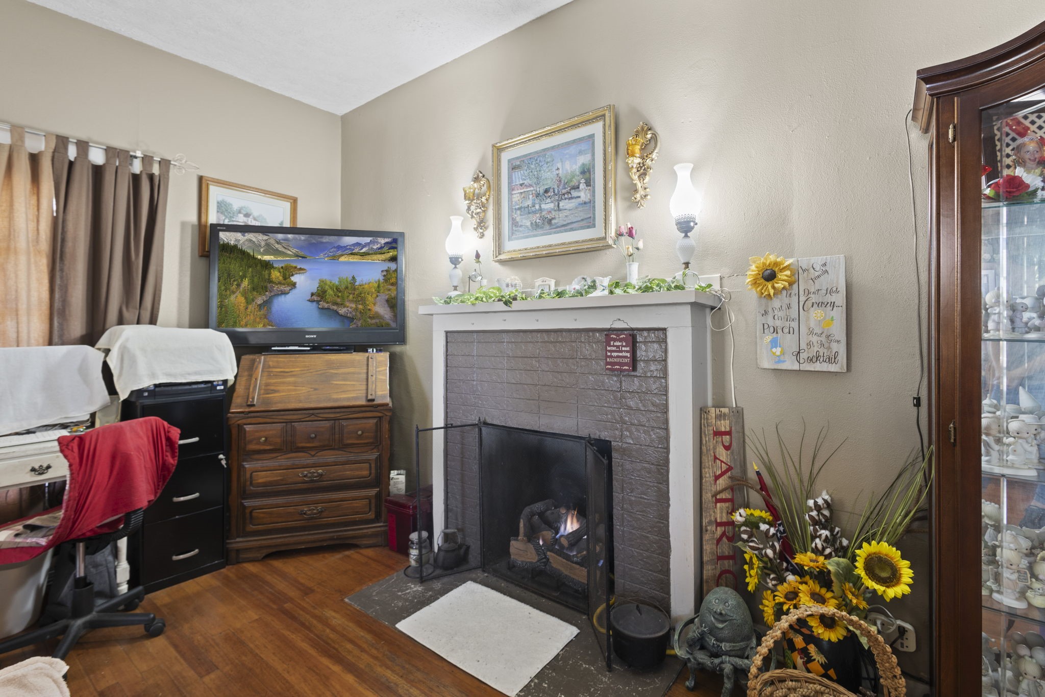 105 Mann Street Colmesneil, TX 75938 - Photo 6 of 40 a living room with furniture and a fireplace