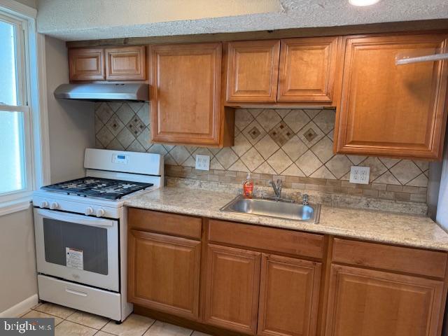 714 Columbus Court Wallingford, PA 19086 - Photo 4 of 9 a kitchen with granite countertop cabinets stainless steel appliances and a sink