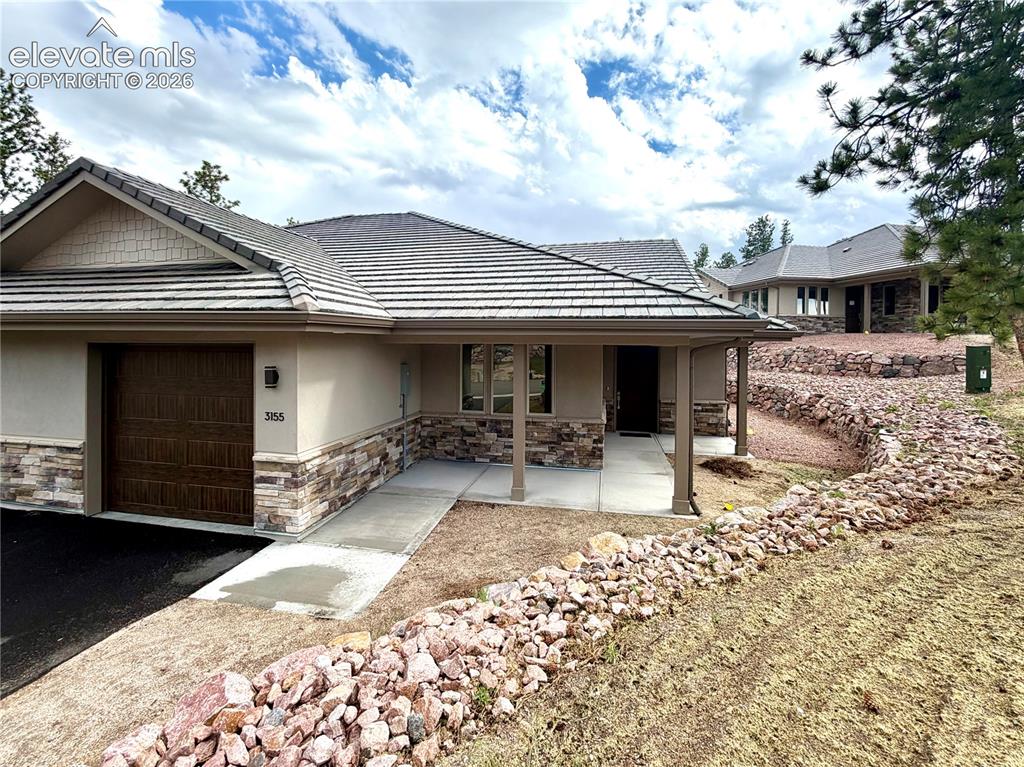 3135 Promise Point Colorado Springs, CO 80921 - Photo 1 of 29 Stone and Stucco exterior with tiled roof make this low-maintenance.