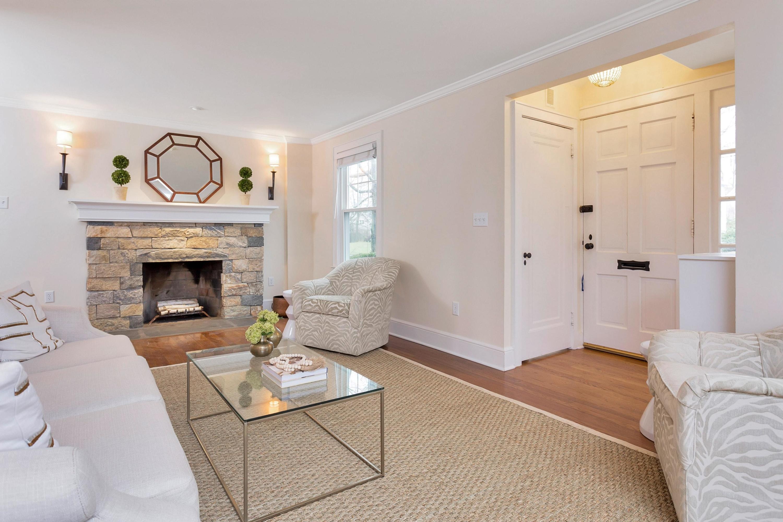 3 Abbey Road Darien, CT 06820 - Photo 3 of 5 a living room with furniture and a fireplace