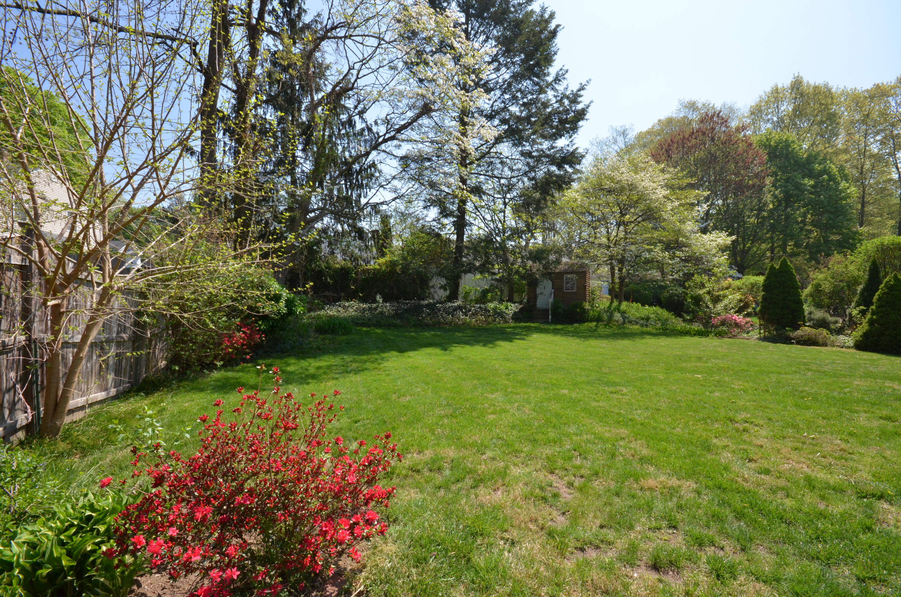 3 Abbey Road Darien, CT 06820 - Photo 5 of 5 a view of a garden with a fountain