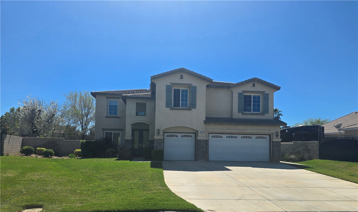41740 Firenze Street Lancaster, CA 93536 - Photo 1 of 53 a front view of a house with yard