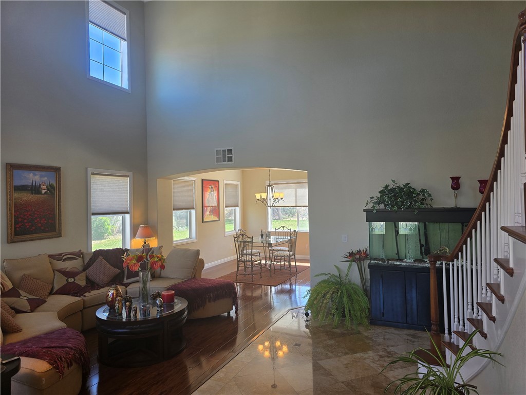 41740 Firenze Street Lancaster, CA 93536 - Photo 11 of 53 a living room with furniture and a large window