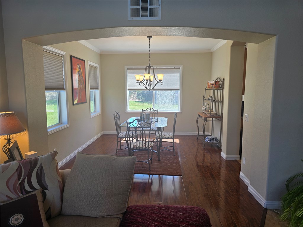 41740 Firenze Street Lancaster, CA 93536 - Photo 12 of 53 a dining room with furniture window wooden floor
