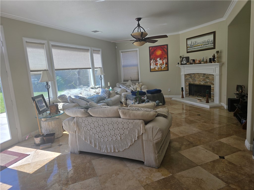 41740 Firenze Street Lancaster, CA 93536 - Photo 14 of 53 a living room with furniture and a fireplace