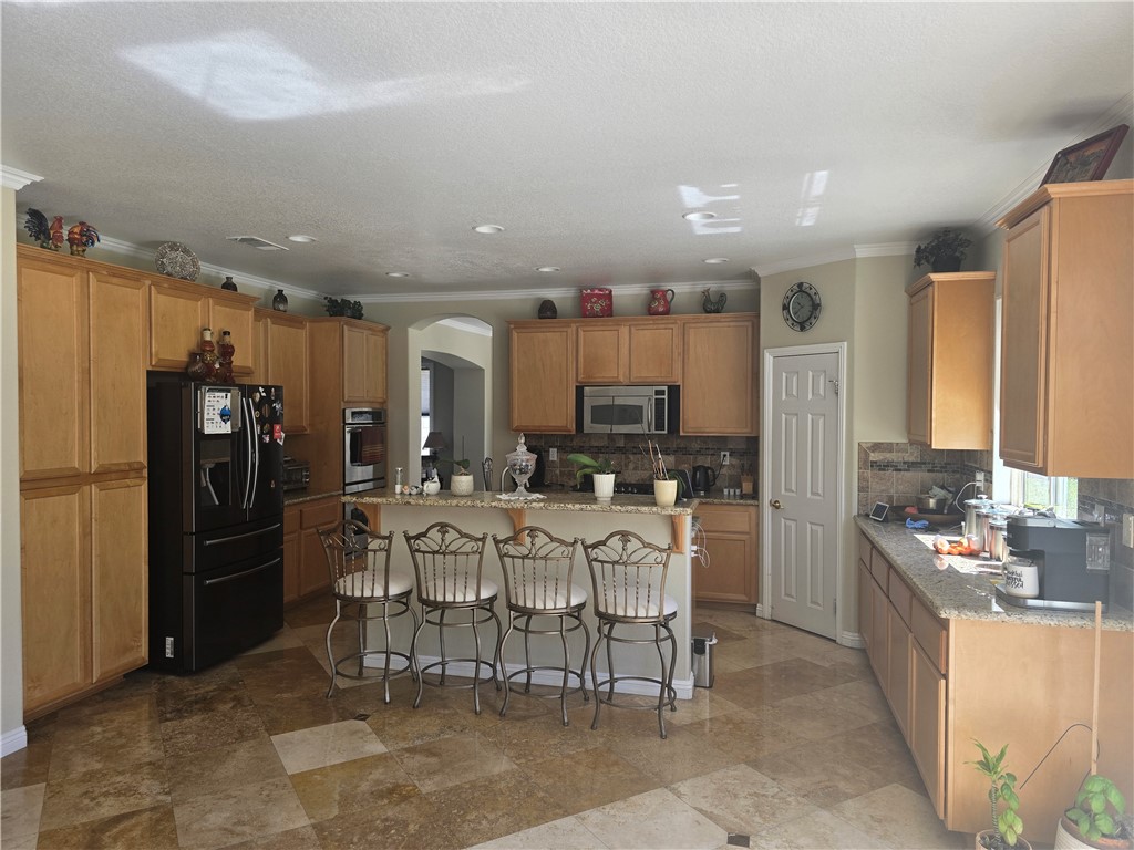 41740 Firenze Street Lancaster, CA 93536 - Photo 22 of 53 a view of a dining room with furniture