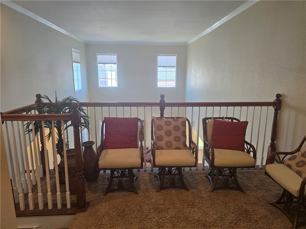 41740 Firenze Street Lancaster, CA 93536 - Photo 28 of 53 a balcony with two chairs and a couch