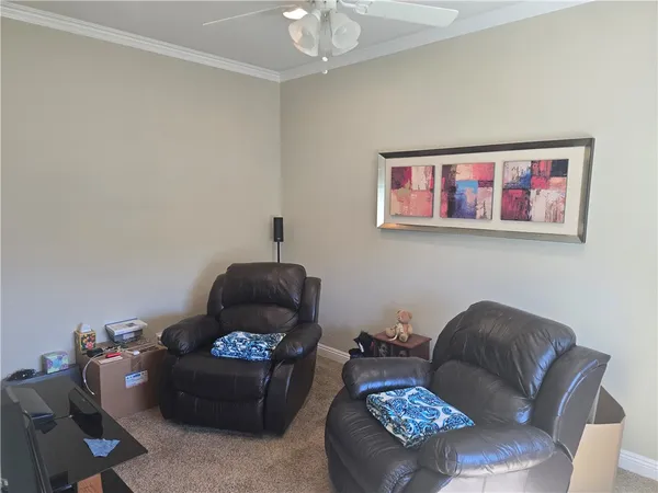 a work room with furniture and window