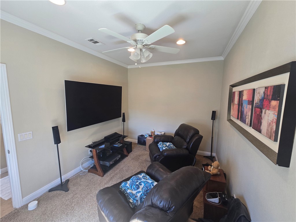 41740 Firenze Street Lancaster, CA 93536 - Photo 41 of 53 a living room with furniture and a flat screen tv