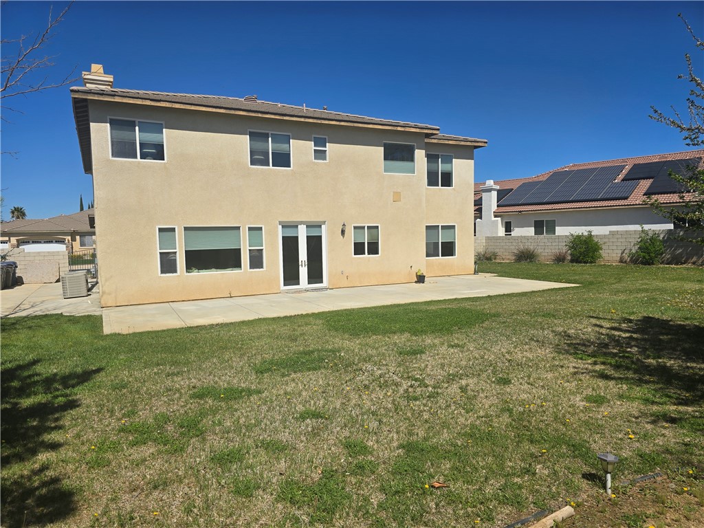 41740 Firenze Street Lancaster, CA 93536 - Photo 52 of 53 a front view of a house with a yard