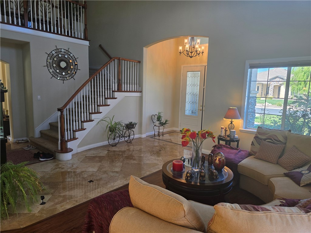 41740 Firenze Street Lancaster, CA 93536 - Photo 6 of 53 a living room with furniture and a large window