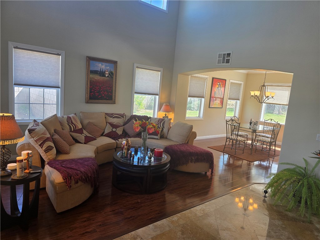 41740 Firenze Street Lancaster, CA 93536 - Photo 10 of 53 a living room with furniture potted plant kitchen view and a window