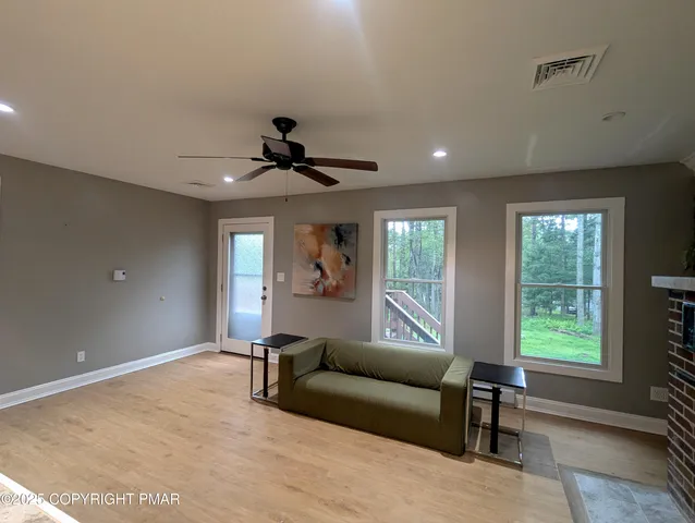 a living room with furniture and a window
