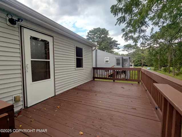 a balcony with wooden floor