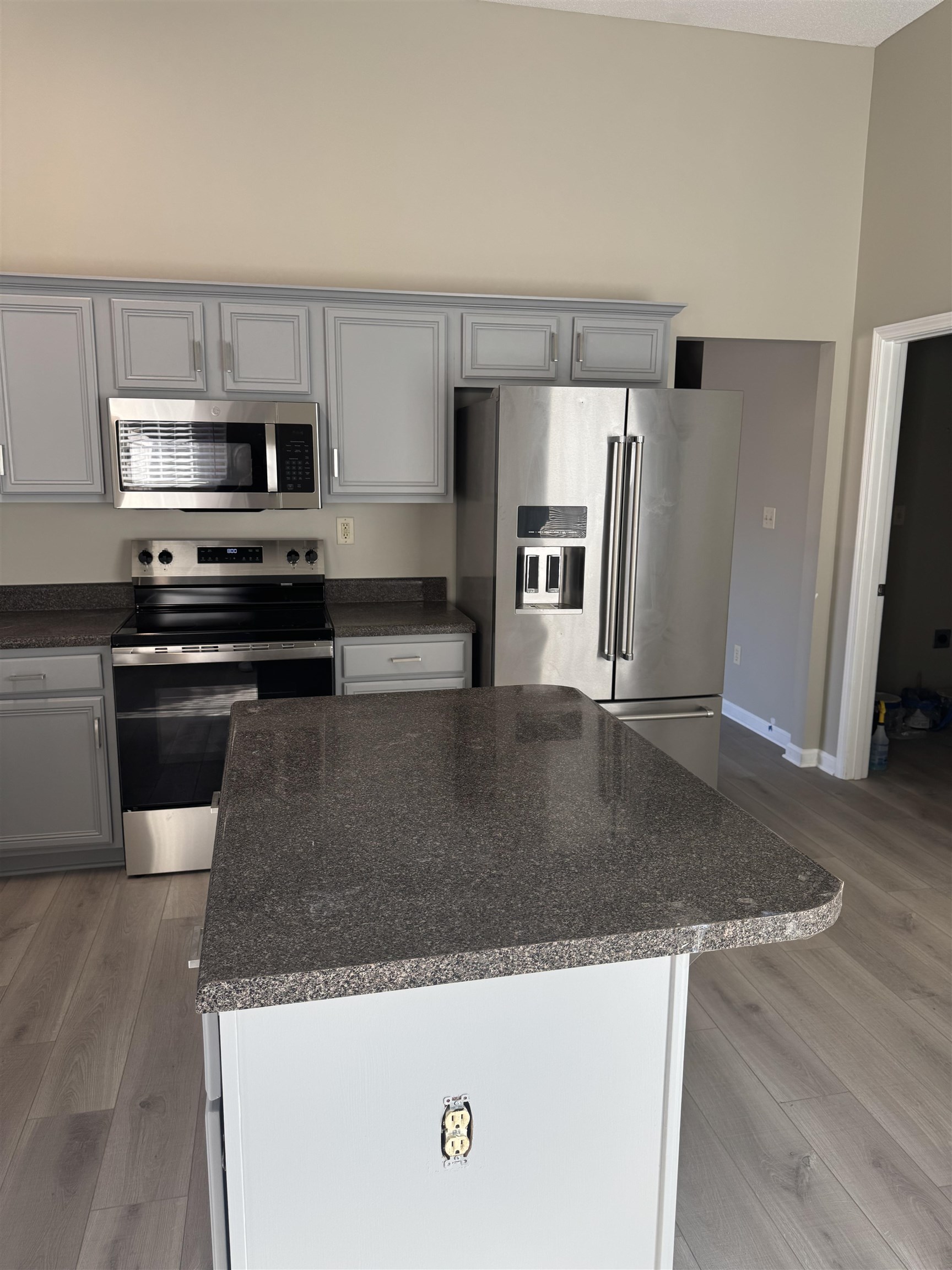 4929 Whitfall Cove South Memphis, TN 38125 - Photo 5 of 22 a kitchen with stainless steel appliances granite countertop a sink a stove and a refrigerator