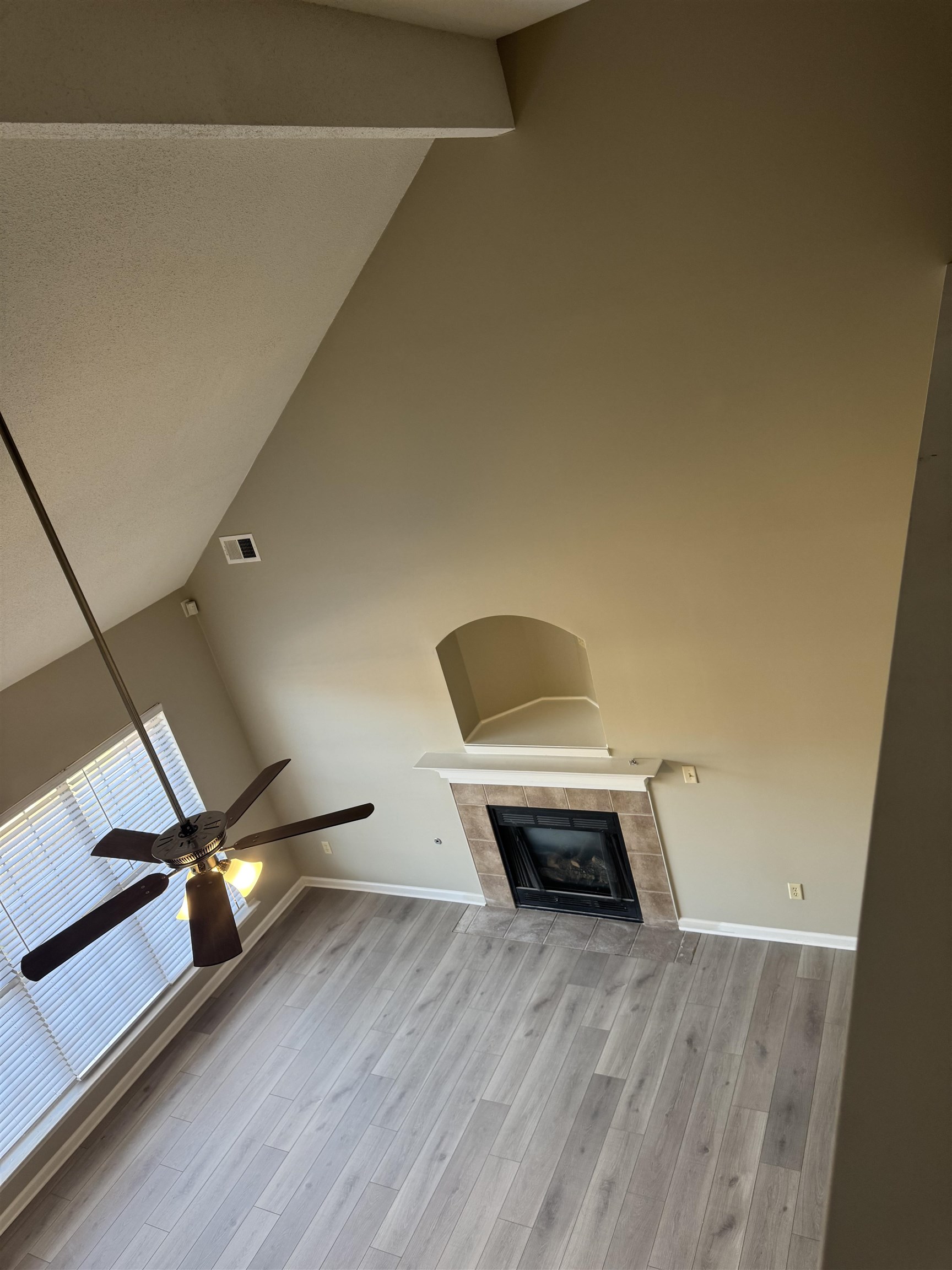 4929 Whitfall Cove South Memphis, TN 38125 - Photo 10 of 22 a living room with a piano and wooden floor