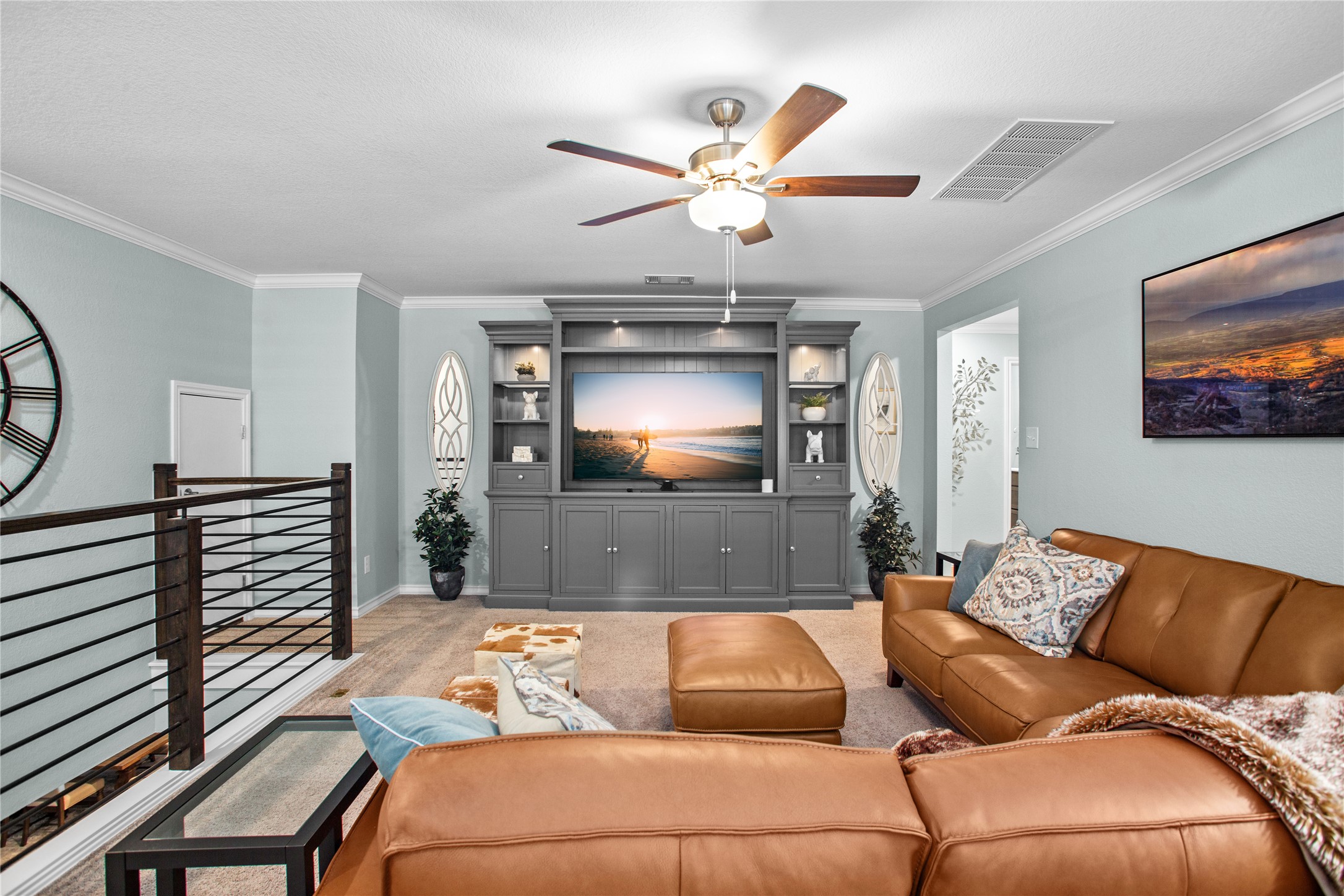109 Adeline Road Hutto, TX 78634 - Photo 28 of 40 Living room with crown molding, ceiling fan, and carpet floors