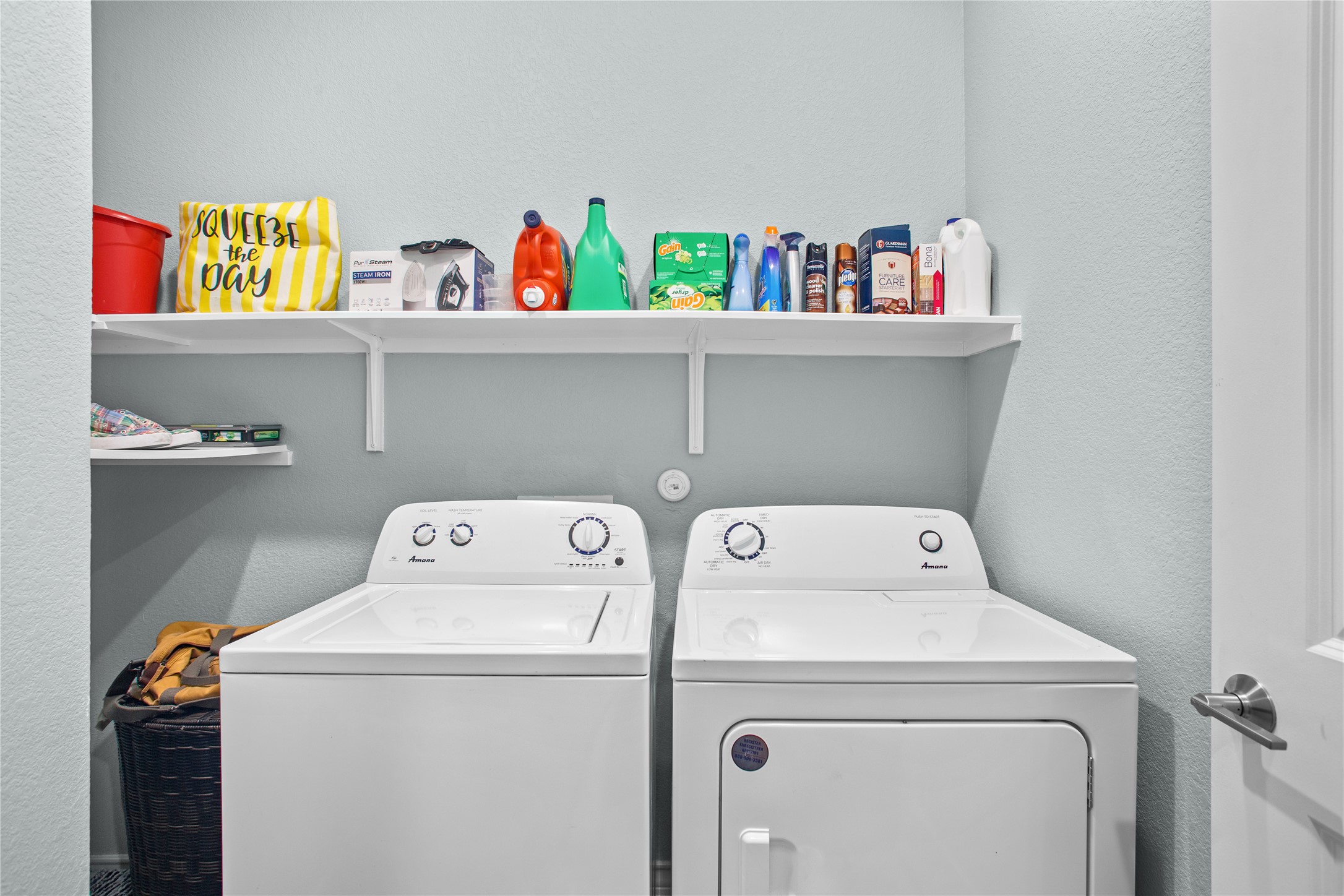 109 Adeline Road Hutto, TX 78634 - Photo 33 of 40 Laundry area featuring a textured wall and washing machine and dryer