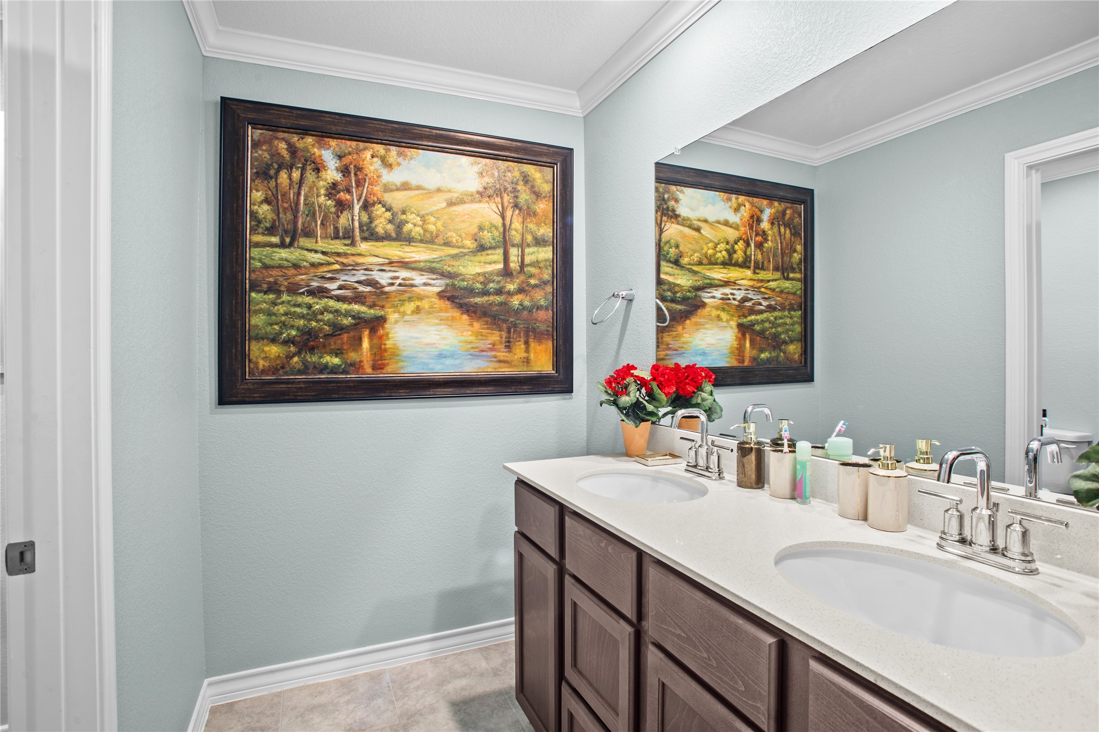 109 Adeline Road Hutto, TX 78634 - Photo 35 of 40 Bathroom with double vanity and ornamental molding