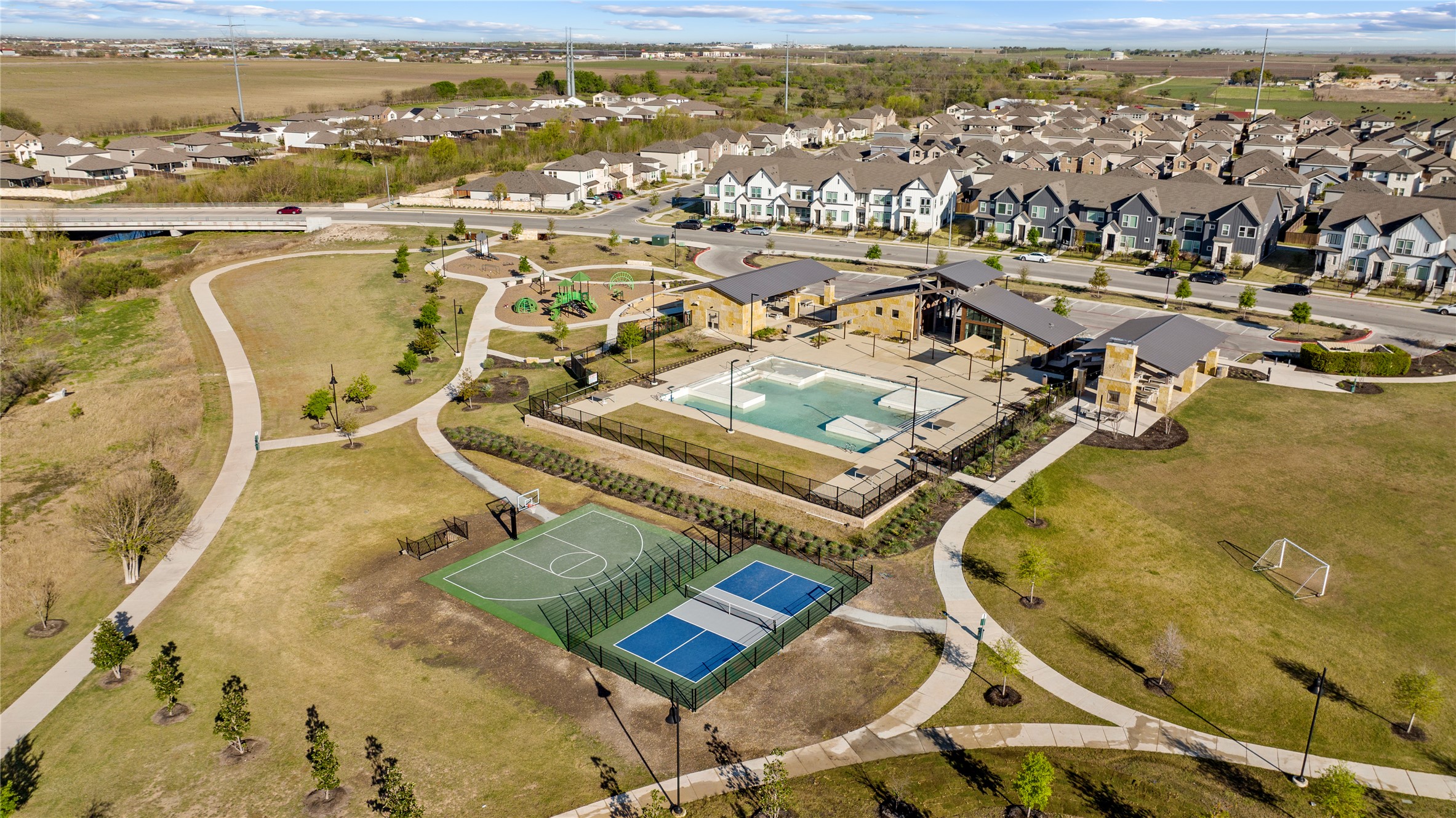 109 Adeline Road Hutto, TX 78634 - Photo 36 of 40 Aerial view of residential area with a pool