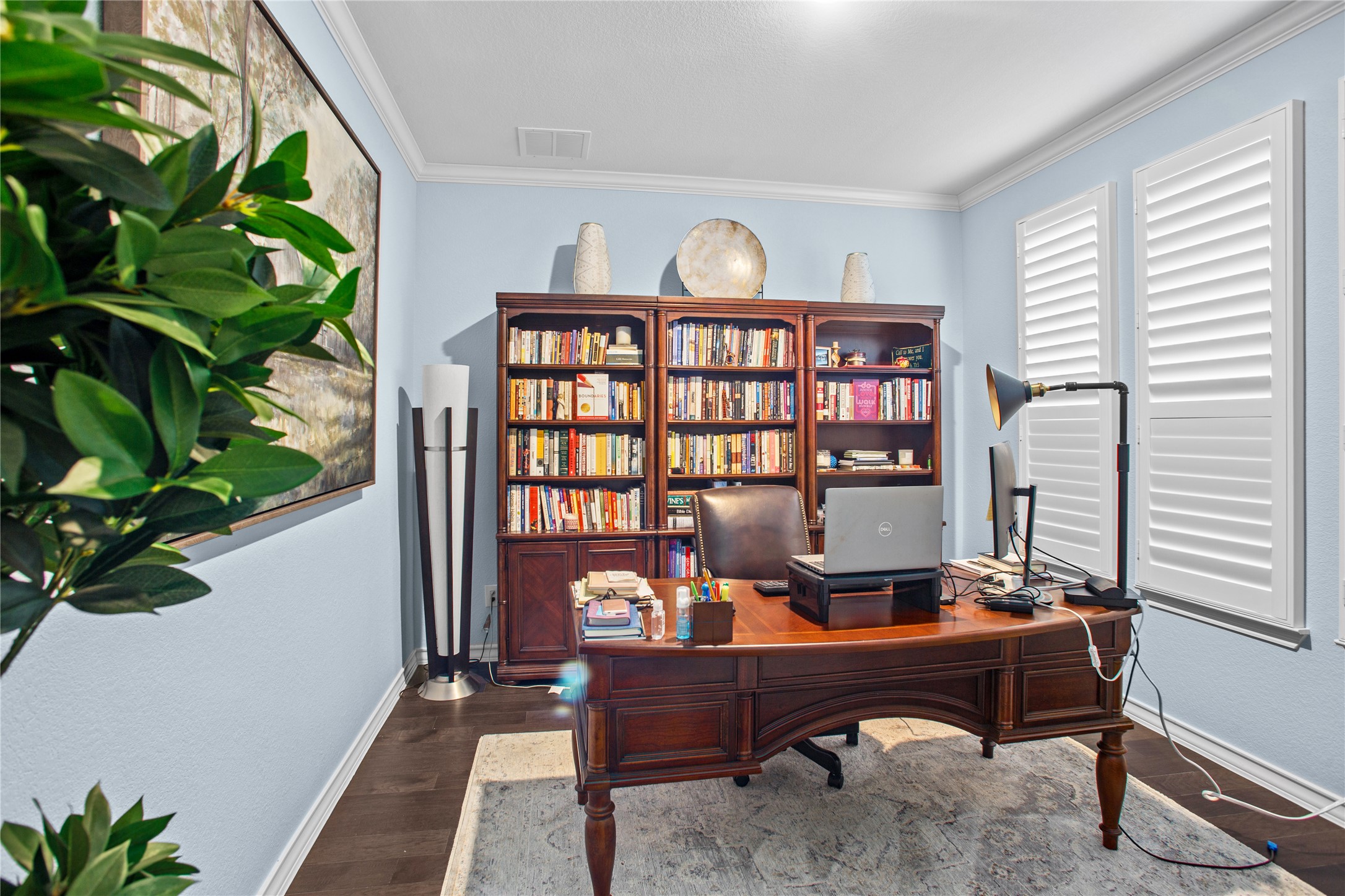 109 Adeline Road Hutto, TX 78634 - Photo 5 of 40 Home office with dark wood-style floors and crown molding